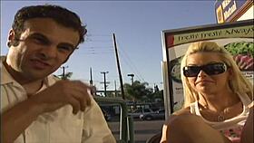 starla looks up at the camera while being closely observed in the scene