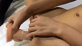 The asian young 18+ sexy babe is sucking my cock at home