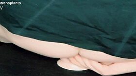 Is this trans woman riding a dildo seductively?