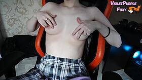 young woman plays with her nipples when she is home alone