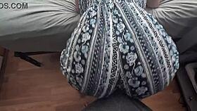 Bouncing ass on his cock in clothes.