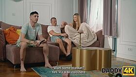 Young girlfriend cheats with older man on sofa