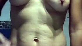 check out this mature spanish woman teasing her big tits and pussy