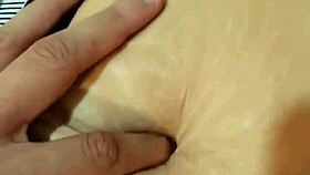 exploring her deep navel in a casual massage session