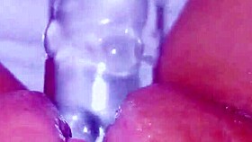 curious asian coed squirts huge on glass toy dildo