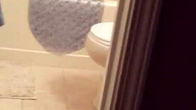 shy girl steps into steamy shower for intimate bathing moment