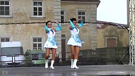 two charming majorettes showcase their energetic cheer skills