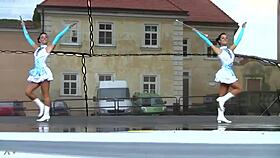 two charming majorettes showcase their energetic cheer skills