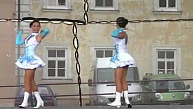 two charming majorettes showcase their energetic cheer skills