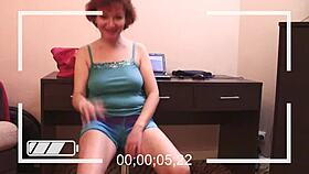 mature redhead teases big natural tits on webcam