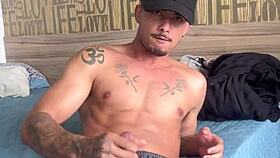 The muscular Brazilian bodybuilder strokes out a creamy solo load sensually.