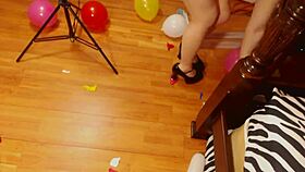 Fifi Foxx pops balloons while strutting in sexy high heels