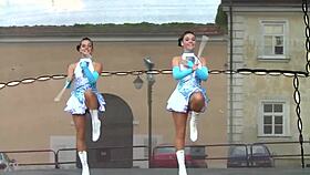 two charming majorettes showcase their energetic cheer skills
