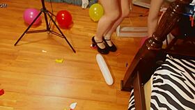 Fifi Foxx pops balloons while strutting in sexy high heels