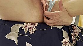 a woman rubs her sensitive spot to an explosive climax in close-up view on bed
