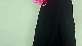 Masked housewife in corset flashes natural tits and dildo on bed