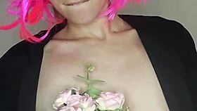 Masked housewife in corset flashes natural tits and dildo on bed