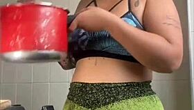 Wifey films cooking but flashes swollen pussy for thrills!