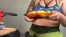 Wifey films cooking but flashes swollen pussy for thrills!