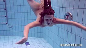 lucy teases by slipping off bikini underwater in pool bath