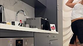 Tattooed blonde flashes meaty pussy and sexy ass in kitchen