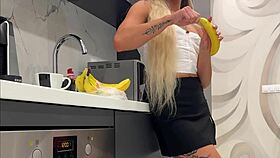 Tattooed blonde flashes meaty pussy and sexy ass in kitchen
