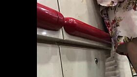 granny browses store shelves in flowing skirt spied from below