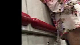 granny browses store shelves in flowing skirt spied from below