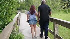 Nerdy milf strokes and sucks big black dick outdoors