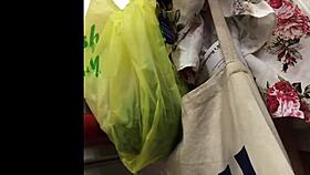 granny browses store shelves in flowing skirt spied from below