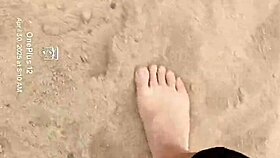 BARE FEET sink into warm sand for sensory fetish play