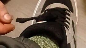 friend enthusiastically trashes sneakers in playful destruction