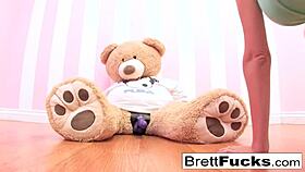 brett rossi experiments with strap-on dildo on stuffed bear