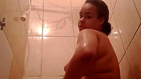 Watch this chubby latina's big ass pussy tease in steamy bath
