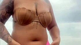 Begging him to whip out hard cock from shorts on beach