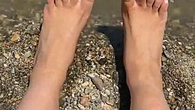 Curvy Asian beauty flaunts feet and soles on sunny beach