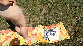 Hairy mature flashes chubby pussy outdoors in public exhibition