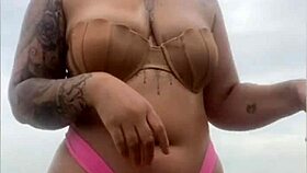 Begging him to whip out hard cock from shorts on beach