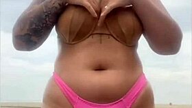 Begging him to whip out hard cock from shorts on beach