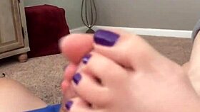 Seductive footjob highlights vibrant purple toes