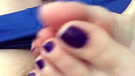 Seductive footjob highlights vibrant purple toes