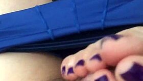 Seductive footjob highlights vibrant purple toes