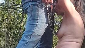 European slave flashes tits in forest for bent over humiliation and cum