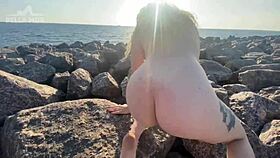 Watch this hot blonde tease her clit right on the public beach?