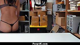 black haired young shoplifter's crime exposed to loss prevention officer in office