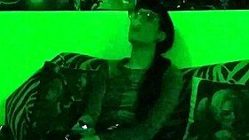 Beth's Kinky Goth Domina Smokes Hot in Green Light!