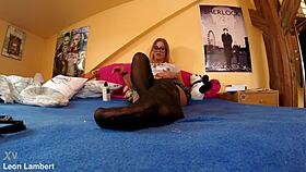 Chrissy shows off her sexy oiled feet in black stockings and lingerie close up.