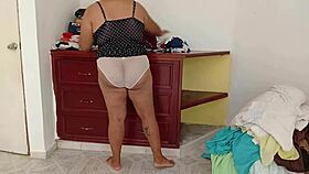 gordita sorts room folds clothes voyeur style