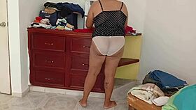 gordita sorts room folds clothes voyeur style