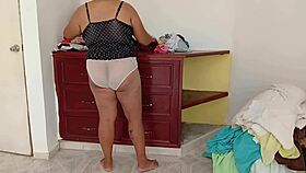 gordita sorts room folds clothes voyeur style
